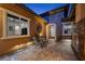 Inviting courtyard with stone accents and outdoor fireplace, perfect for relaxing evenings at 294 Besame Ct, Las Vegas, NV 89138
