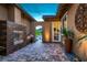 Private courtyard with decorative fireplace creating a cozy outdoor living space at 294 Besame Ct, Las Vegas, NV 89138