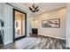 Bright foyer with tile flooring, modern light fixture, and courtyard view from the sidelight window at 294 Besame Ct, Las Vegas, NV 89138