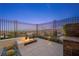 This backyard has a fire pit and seating area with views of the city at 294 Besame Ct, Las Vegas, NV 89138