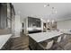 Modern kitchen featuring a large island, stainless steel appliances, and dark wood cabinetry at 294 Besame Ct, Las Vegas, NV 89138