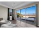 Bright living room with expansive glass doors offering stunning outdoor views at 294 Besame Ct, Las Vegas, NV 89138