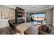Open-concept living room features a fireplace and outdoor access to a patio at 294 Besame Ct, Las Vegas, NV 89138