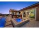 Outdoor living space includes a sparkling pool and an outdoor kitchen at 294 Besame Ct, Las Vegas, NV 89138