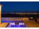 Inviting pool with city view and lounge chairs perfect for relaxing outdoors after dark at 294 Besame Ct, Las Vegas, NV 89138
