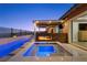 A gorgeous home outdoor pool featuring a modern patio with a covered seating area and fireplace at 294 Besame Ct, Las Vegas, NV 89138