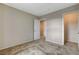 Neutral bedroom featuring carpet floors, a walk-in closet, and ensuite bathroom access at 3165 Brynley Ave, Henderson, NV 89044