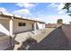 Spacious backyard featuring gravel ground cover and covered patio at 3672 Madrid St, Las Vegas, NV 89121