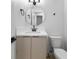 Contemporary bathroom features a round mirror and modern fixtures at 3672 Madrid St, Las Vegas, NV 89121