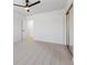 Cozy bedroom featuring neutral carpet, a ceiling fan, and mirrored closet doors at 3672 Madrid St, Las Vegas, NV 89121