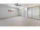 Open and bright bedroom with neutral carpet and large mirrored closets at 3672 Madrid St, Las Vegas, NV 89121