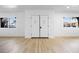 Bright foyer featuring light wood flooring and a double front door with decorative windows at 3672 Madrid St, Las Vegas, NV 89121
