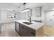 Bright kitchen features a central island, modern lighting, and stainless steel appliances at 3672 Madrid St, Las Vegas, NV 89121