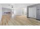 Open-concept living room features a modern fireplace and light wood-look flooring at 3672 Madrid St, Las Vegas, NV 89121