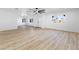 Open-concept living room featuring light wood flooring and double door entryway at 3672 Madrid St, Las Vegas, NV 89121