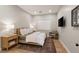 Neutral bedroom with hardwood floors, a serene color palette, and a comfortable seating area at 381 Cliff Terrace Ave, Las Vegas, NV 89138