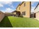 Well-maintained backyard boasts lush green turf, perfect for entertaining and relaxation at 3835 Berenices Ave, North Las Vegas, NV 89084