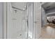 Bathroom with a glass-enclosed shower and a white tiled wall at 3835 Berenices Ave, North Las Vegas, NV 89084