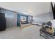 A large bonus room with soft carpet and a TV at 3835 Berenices Ave, North Las Vegas, NV 89084