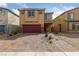 Charming two-story home showcasing a well-manicured front yard and a two car garage at 3835 Berenices Ave, North Las Vegas, NV 89084