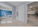A main bedroom with tiled floors, a walk-in closet, and an ensuite bathroom at 3835 Berenices Ave, North Las Vegas, NV 89084