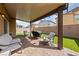 Outdoor patio offers a lovely, furnished seating area and barbecue space at 3835 Berenices Ave, North Las Vegas, NV 89084