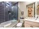 View of bath/shower combo with blue subway tile and white vanity with framed mirror at 4273 Sunrise Flats St, Las Vegas, NV 89135