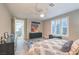 Another view of this primary bedroom featuring plantation shutters, a ceiling fan, and blue accents at 4273 Sunrise Flats St, Las Vegas, NV 89135