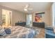 Spacious primary bedroom offering plantation shutters, blue accents, and contemporary furnishings at 4273 Sunrise Flats St, Las Vegas, NV 89135