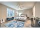 Serene primary bedroom with neutral tones, ceiling fan, plantation shutters, and stylish furniture at 4273 Sunrise Flats St, Las Vegas, NV 89135