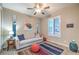 Bedroom with neutral paint, ceiling fan, and multiple windows for natural light at 4273 Sunrise Flats St, Las Vegas, NV 89135