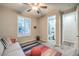 A secondary bedroom with a ceiling fan, and access to a private ensuite bathroom at 4273 Sunrise Flats St, Las Vegas, NV 89135