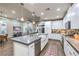 Spacious kitchen with a large island, stainless steel appliances, and sleek white cabinetry at 4273 Sunrise Flats St, Las Vegas, NV 89135