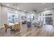 Spacious living room with wood-look tile flooring, recessed lighting, and modern window treatments at 4273 Sunrise Flats St, Las Vegas, NV 89135