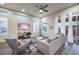 Bright living room with stylish furnishings, ceiling fan, and sliding doors to outdoor space at 4273 Sunrise Flats St, Las Vegas, NV 89135