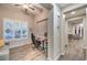 Bright home office with modern ceiling fan, lots of natural light, and wood-look tile floors at 4273 Sunrise Flats St, Las Vegas, NV 89135
