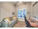 Cozy home office featuring a comfortable couch, a desk, and lots of natural light from the window at 4273 Sunrise Flats St, Las Vegas, NV 89135