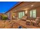 Lovely covered patio featuring brick pavers, desert landscaping, and inviting seating arrangement at 4273 Sunrise Flats St, Las Vegas, NV 89135