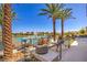 Community pool area features palm trees, lounge seating, and desert landscape at 4273 Sunrise Flats St, Las Vegas, NV 89135