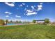 Well-maintained community tennis courts surrounded by lush green lawns and shade trees at 4273 Sunrise Flats St, Las Vegas, NV 89135