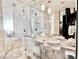 Luxurious bathroom featuring marble walls, glass-enclosed shower, and modern fixtures at 4381 W Flamingo Rd # 12304, Las Vegas, NV 89103