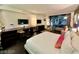 Modern bedroom featuring large windows with city views, a large desk, and sleek furnishings at 4381 W Flamingo Rd # 12304, Las Vegas, NV 89103