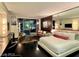 Modern bedroom featuring a king-sized bed, a sitting area, and floor-to-ceiling windows with a city view at 4381 W Flamingo Rd # 12304, Las Vegas, NV 89103