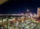 Nighttime view of the sparkling city skyline, including lit-up buildings and busy streets at 4381 W Flamingo Rd # 12304, Las Vegas, NV 89103