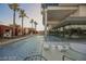Outdoor pool area featuring lounge chairs, poolside cabanas, and lush landscaping at 4381 W Flamingo Rd # 12304, Las Vegas, NV 89103