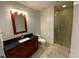 A bathroom featuring a vanity with granite counter, a sink and a glass-door shower at 4525 Dean Martin Dr # 911, Las Vegas, NV 89103