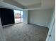 A large bedroom with carpet, neutral paint, and a window view of the city at 4525 Dean Martin Dr # 911, Las Vegas, NV 89103
