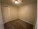 A cozy bedroom featuring neutral walls, carpeted floors, and a closet with bi-fold doors at 4525 Dean Martin Dr # 911, Las Vegas, NV 89103