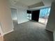 A large bedroom with carpet, neutral paint, and a window view of the city at 4525 Dean Martin Dr # 911, Las Vegas, NV 89103