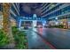 Night shot of a condominium entrance with prominent signage, landscaping, and circular driveway at 4525 Dean Martin Dr # 911, Las Vegas, NV 89103